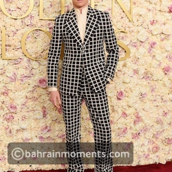 Eddie Redmayne in a checkered statement suit